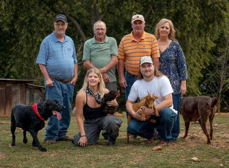 chip-photo-11 About Chip Candidate for Woodfin Town Council Maxwell Chip Parton III and his fiancée, family, two dogs, a goat, and chicken pose for a group photo.