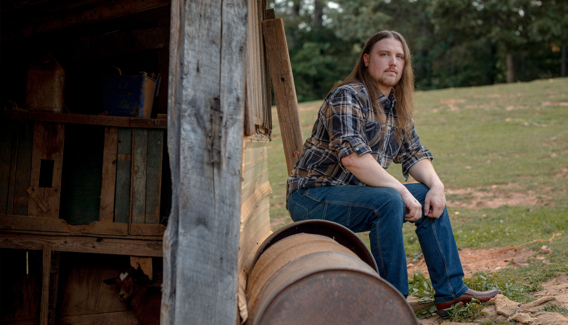 chip-photo-20 Chip Parton sits on an old container next to a barn on his farm in Woodfin, North Caroina. Donate today.